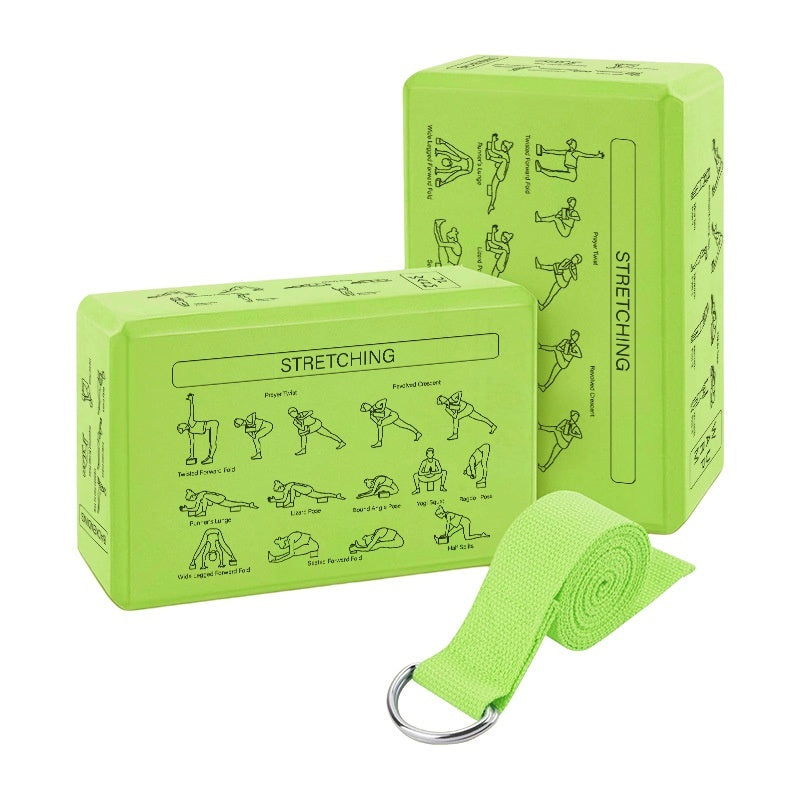 Two green yoga blocks with stretching illustrations and a green yoga strap on a white background