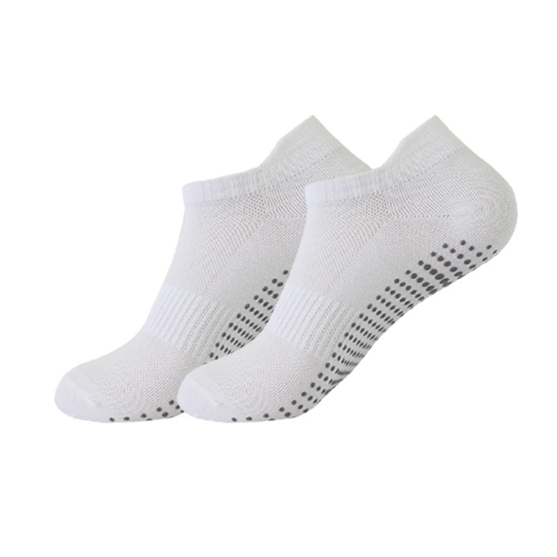 Two pairs of white socks with black patterns on a white background