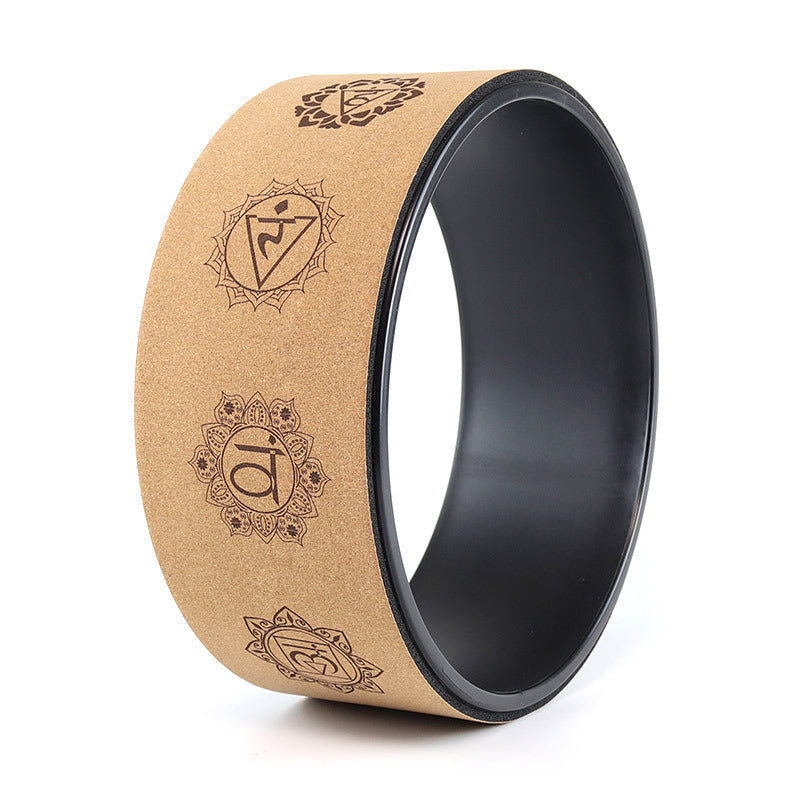 Two rings, one brown with engraved symbols and one black, on a white background