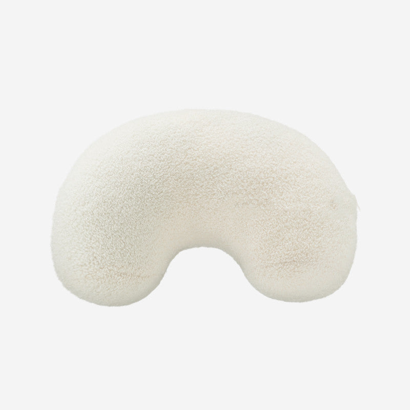 White U-shaped pillow on a white background