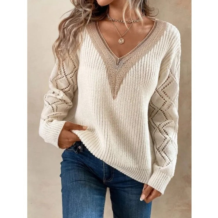 Woman wearing a beige knitted sweater and blue jeans against a neutral background