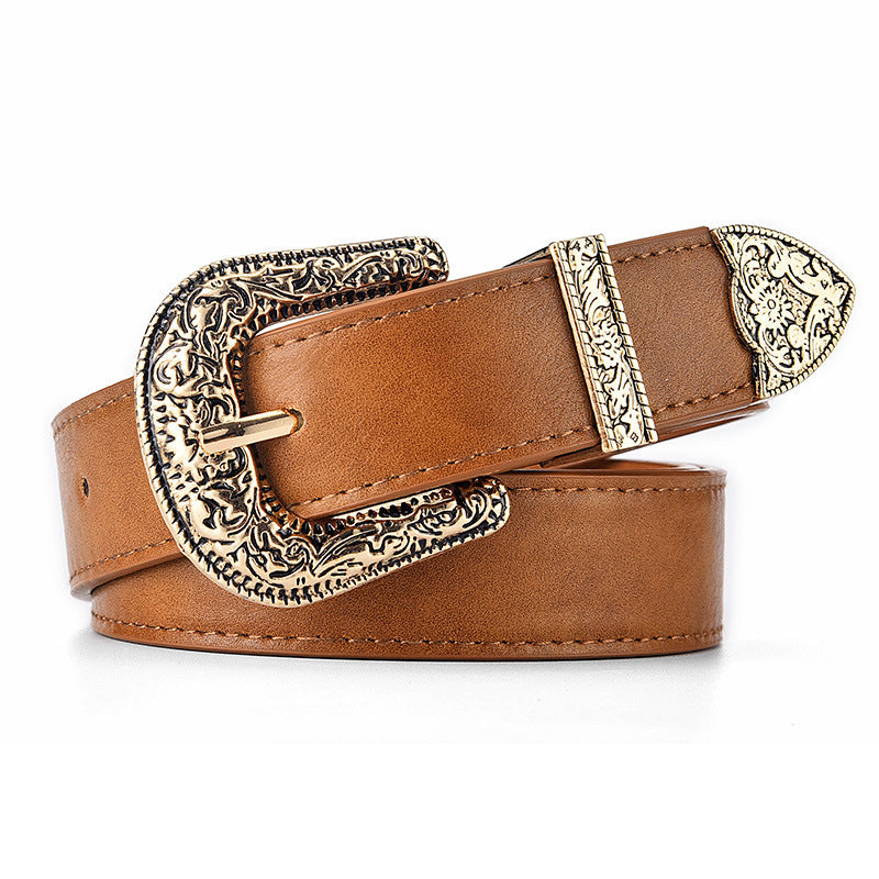 Brown leather belt with ornate gold buckle on a white background
