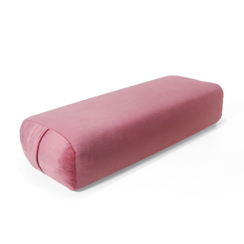 Pink cylindrical pillow on a white background