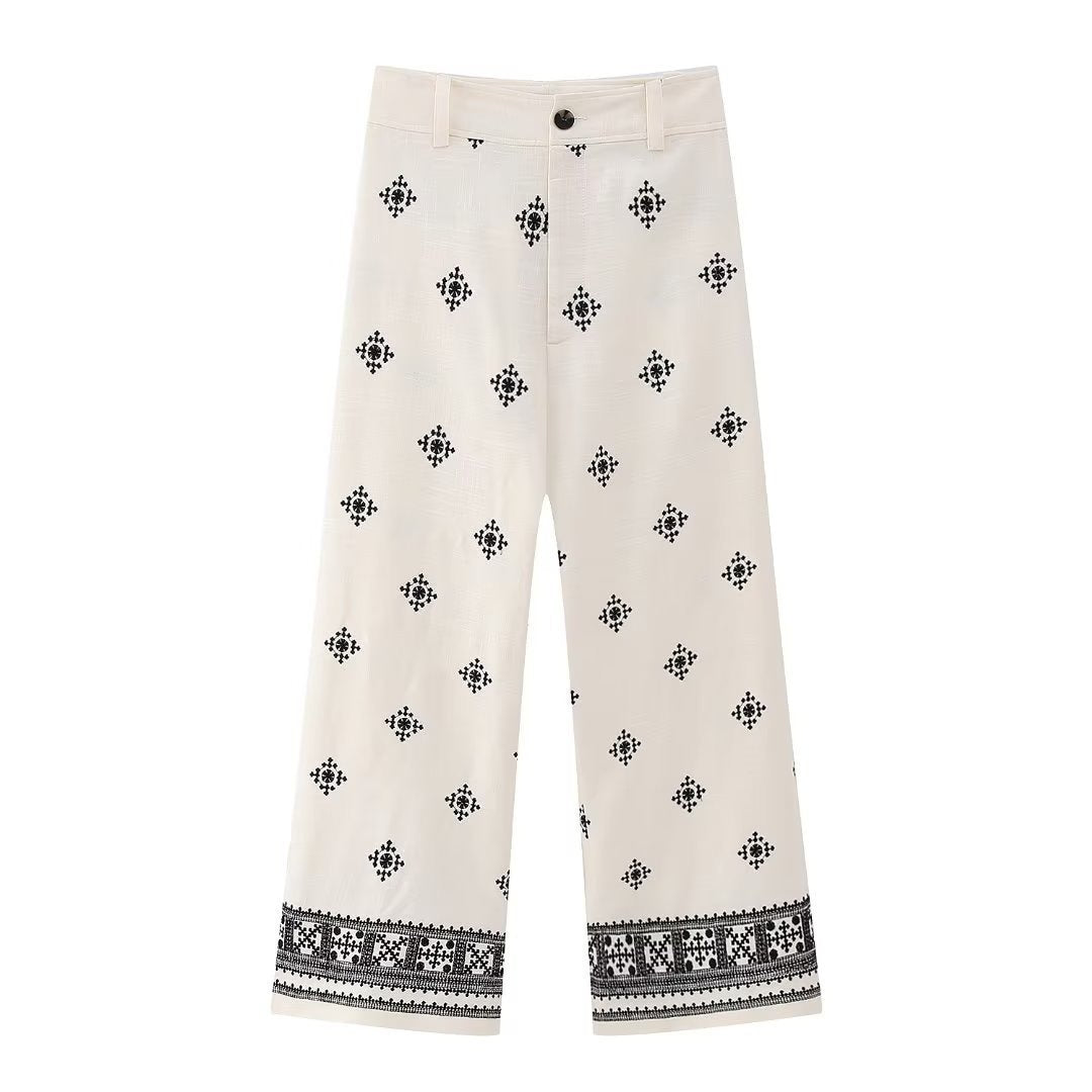 White pants with black geometric pattern on a white background