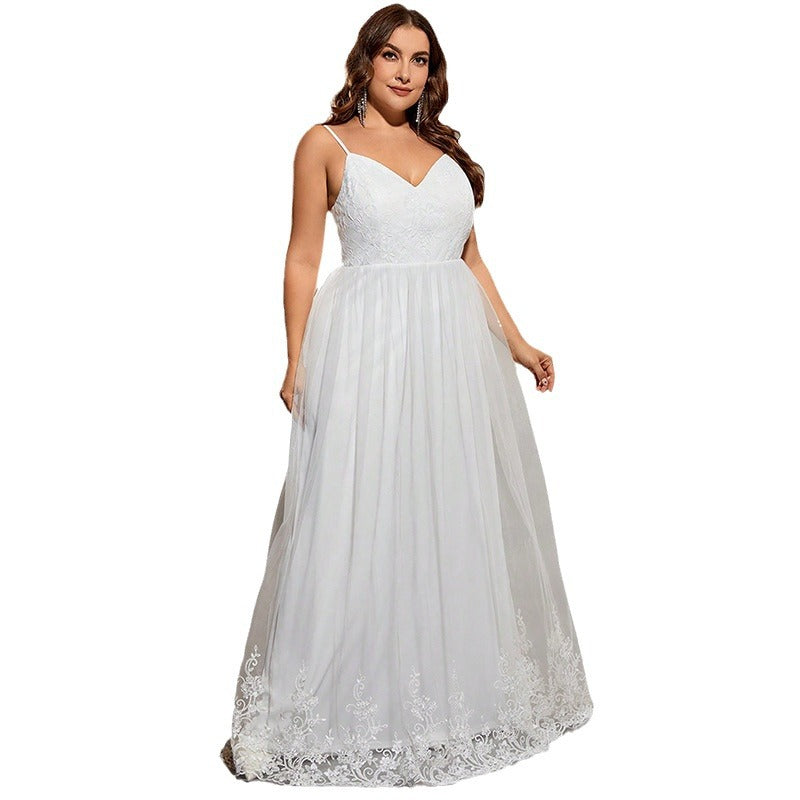 Woman wearing a white lace dress on a white background
