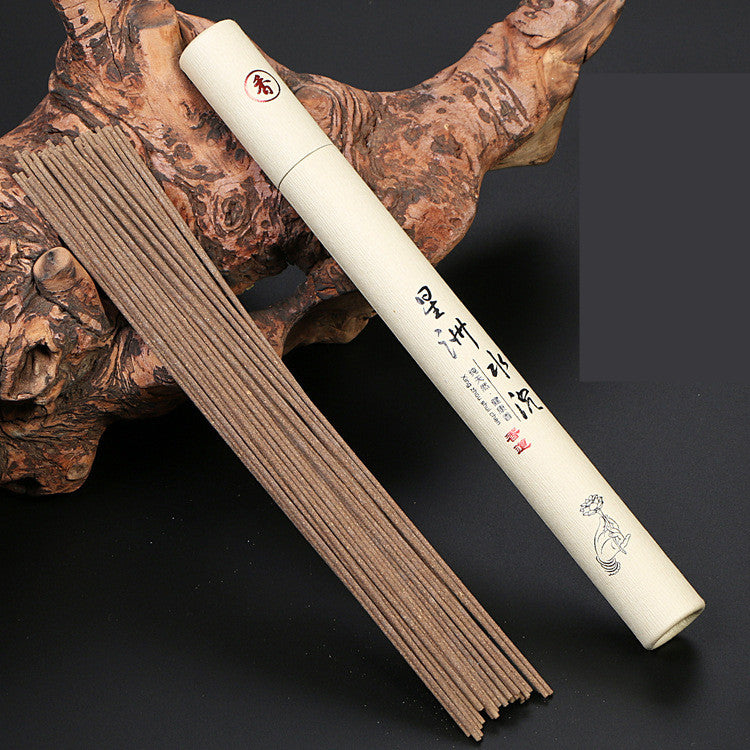 White incense stick holder with incense sticks on a dark background