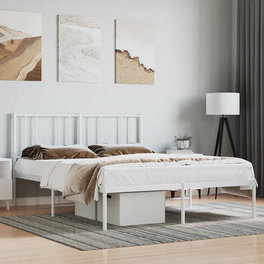 White metal bed frame with brown bedding in a bedroom setting.