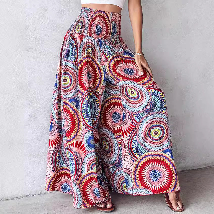 Colorful patterned pants worn by a person against a plain background