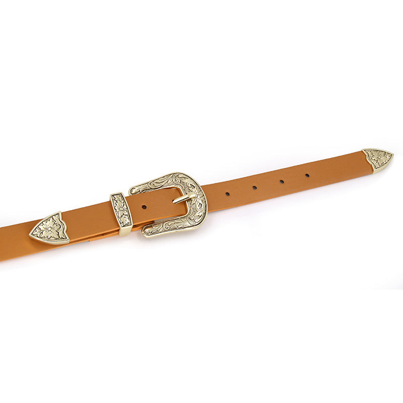 Brown belt with decorative buckle on a white background