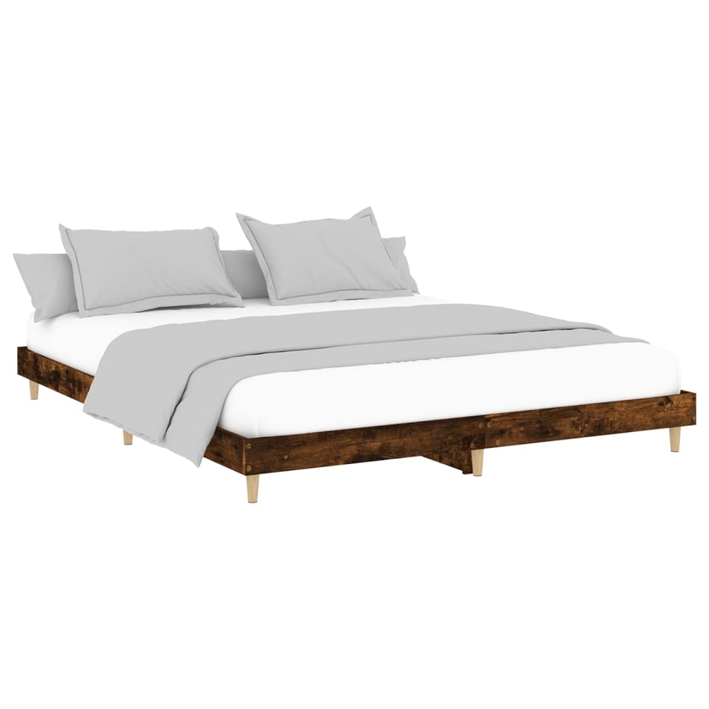 Wooden bed frame with slatted design on a white background