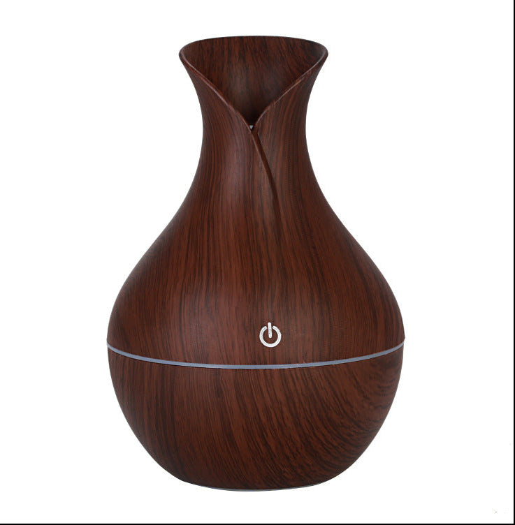 Wooden-textured diffuser with power symbol on a white background