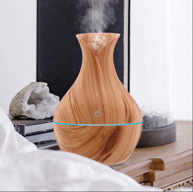 Wooden diffuser emitting steam with text about fresh air at home.