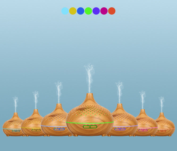 Wooden diffusers emitting mist on a blue background with color swatches above.