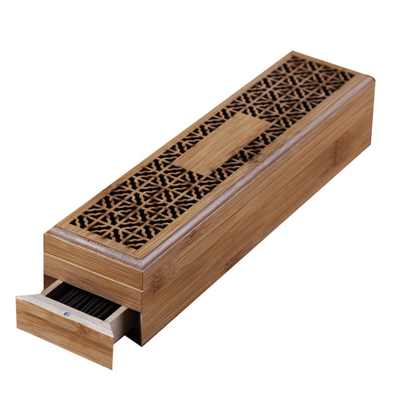 Wooden incense burner with intricate design on a white background