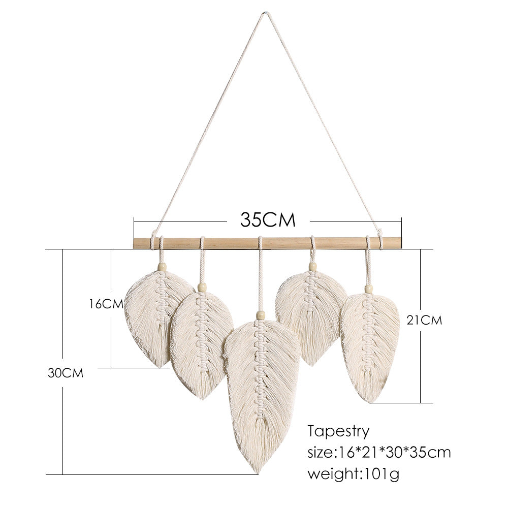 Macrame wall hanging with leaf-shaped decorations and measurements on a white background