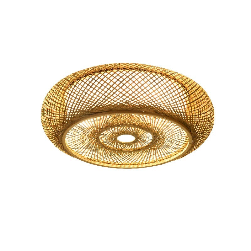 Woven gold ceiling light fixture on a white background