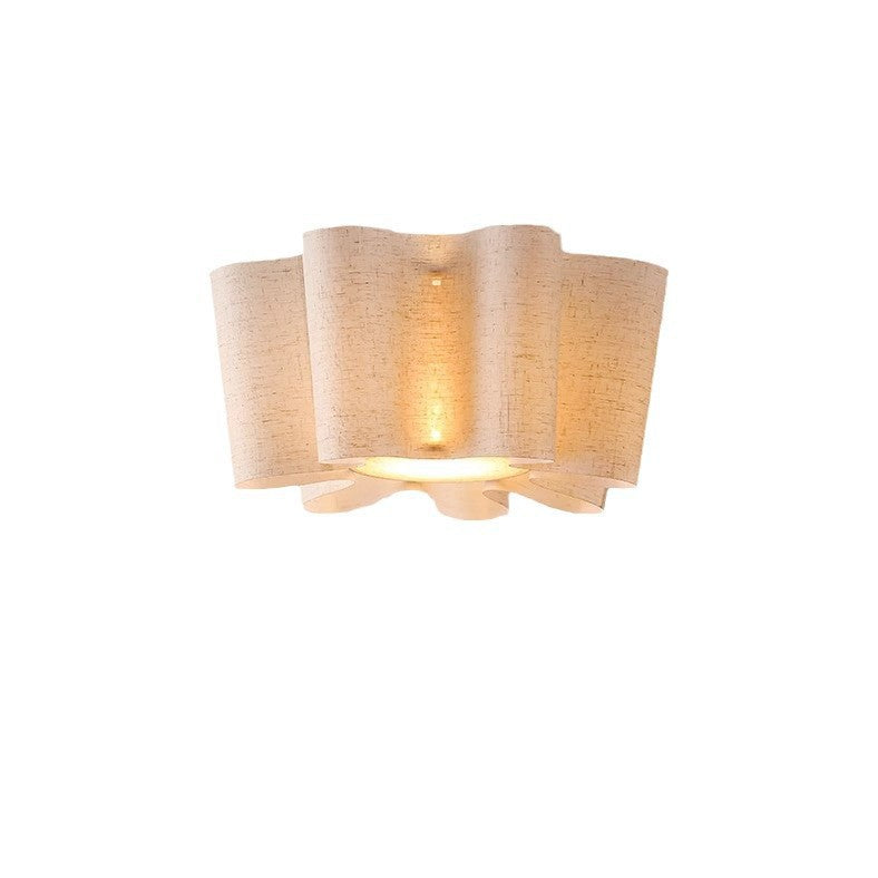 Woven wall light fixture on a white background