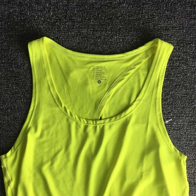 Yellow tank top on a dark textured surface
