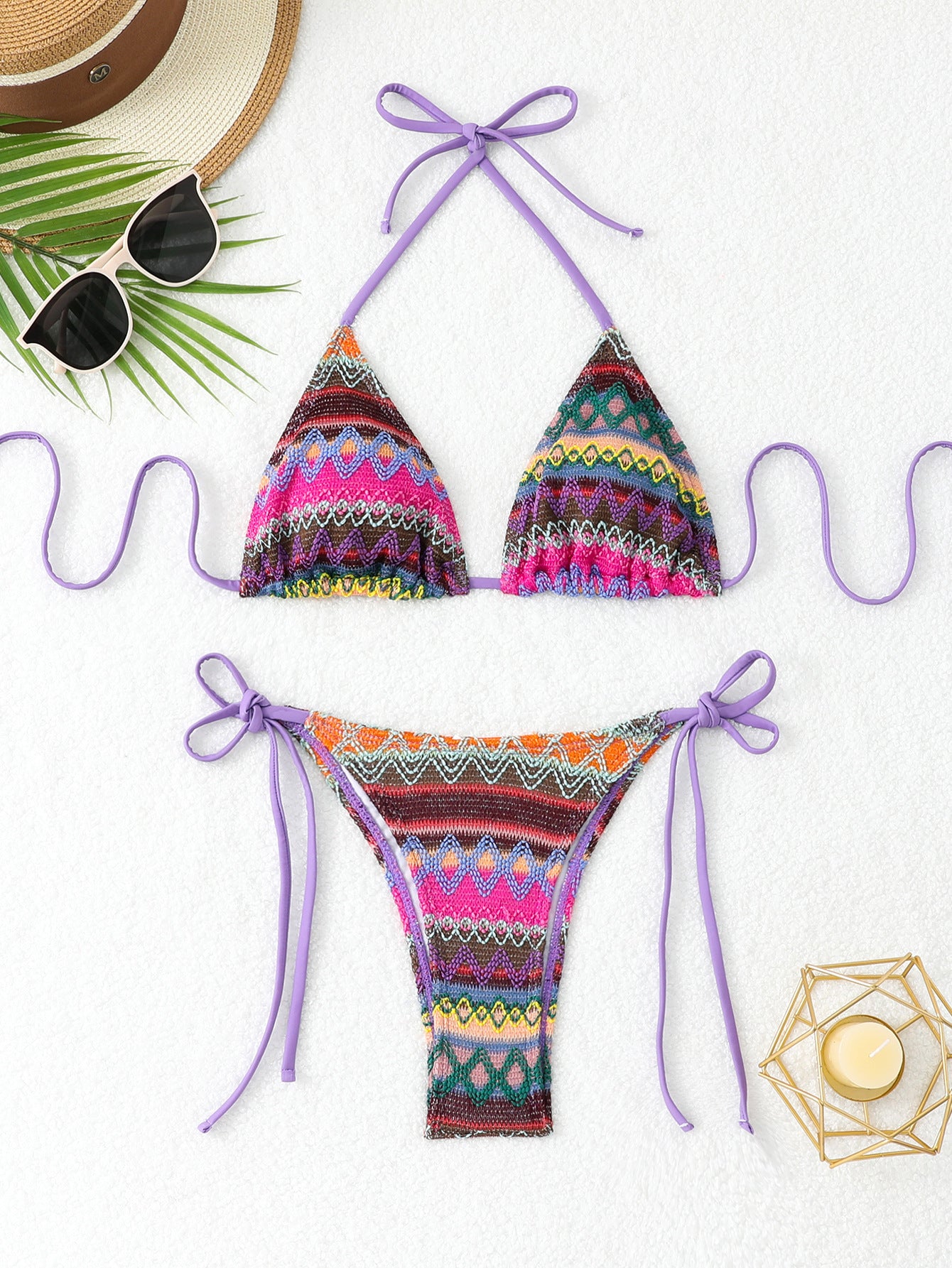 Colorful bikini set with purple straps on a white background