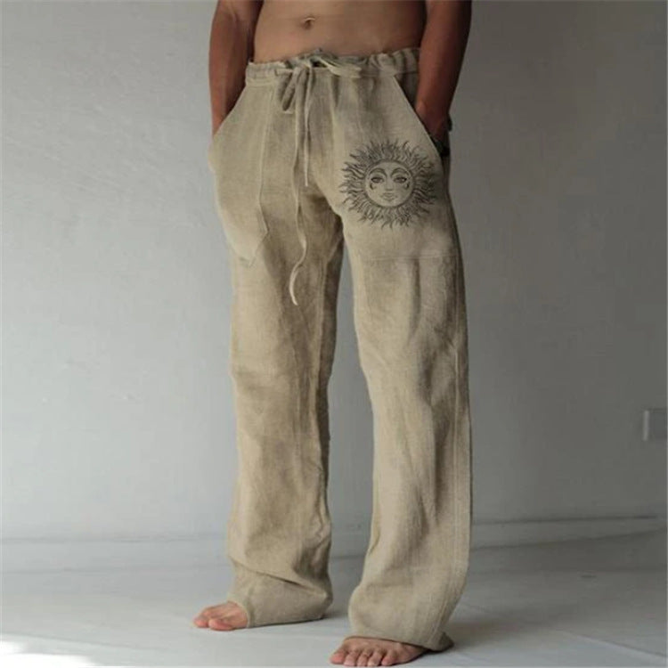 Beige linen pants with a sun design on a plain background