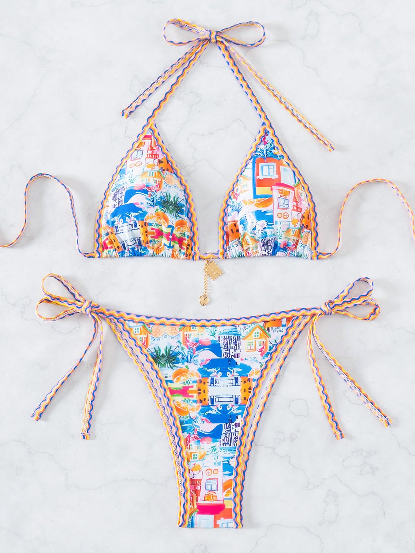 Colorful bikini set with abstract pattern on a white background