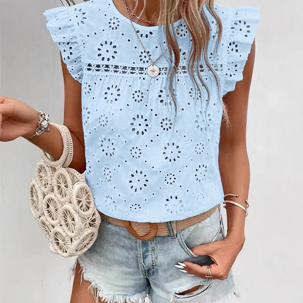 Light blue lace top worn by a person with a white background