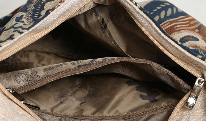 Open bag showing interior structure with zipper pockets