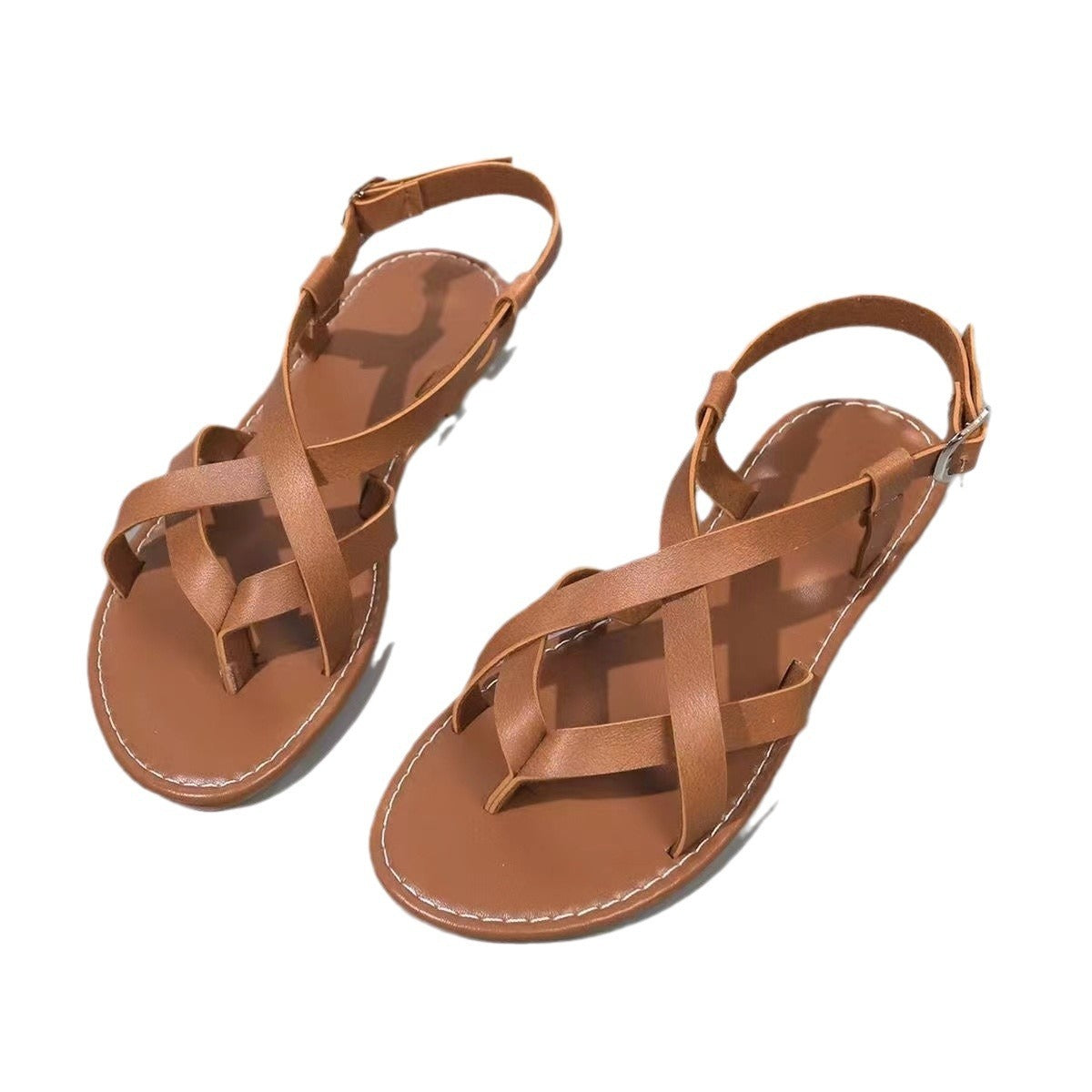 Pair of brown sandals on a white background