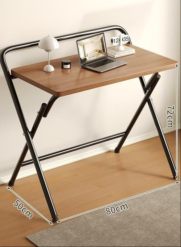 Foldable desk with light walnut top and black frame, shown with dimensions and usage suggestions.