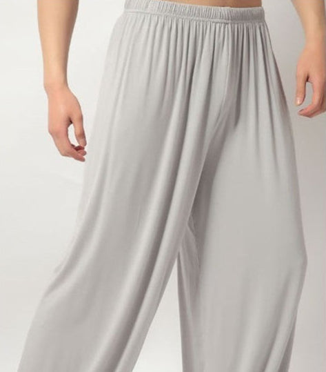 Light gray wide-leg pants on a plain background