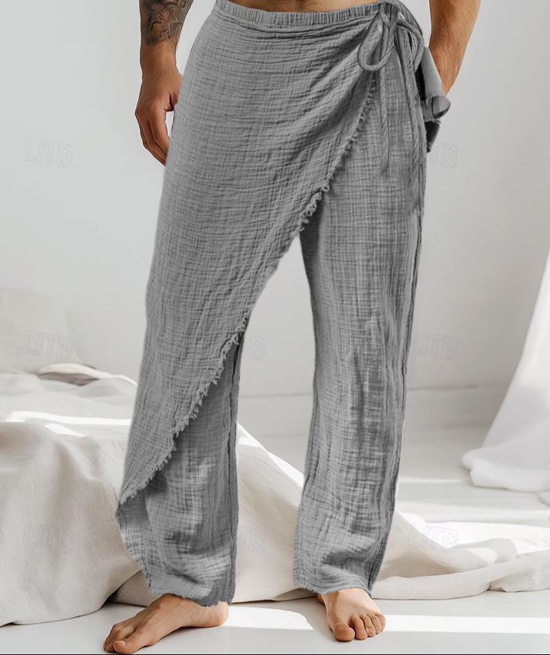Person wearing gray checkered pants on a white background