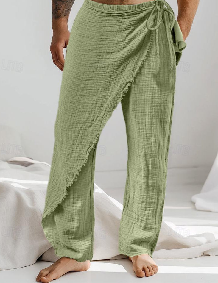 Person wearing green checkered pants on a white background