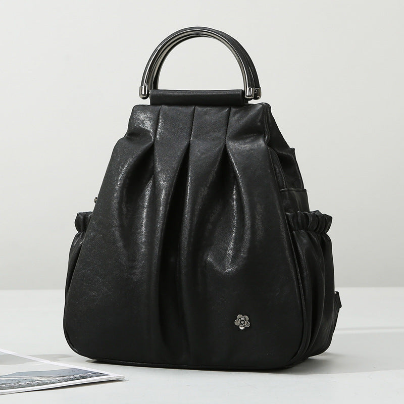 Black leather handbag on a white background