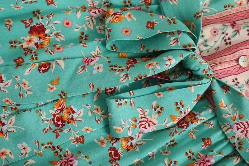 Close-up of turquoise fabric with floral pattern