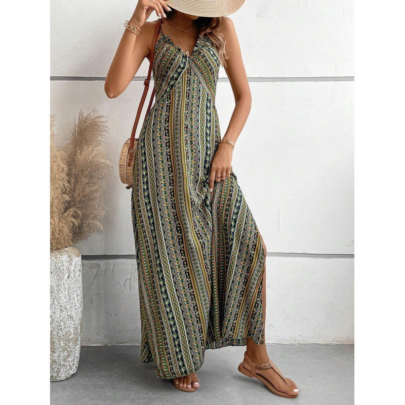 Woman wearing a patterned dress with a white wall and decorative plant in the background