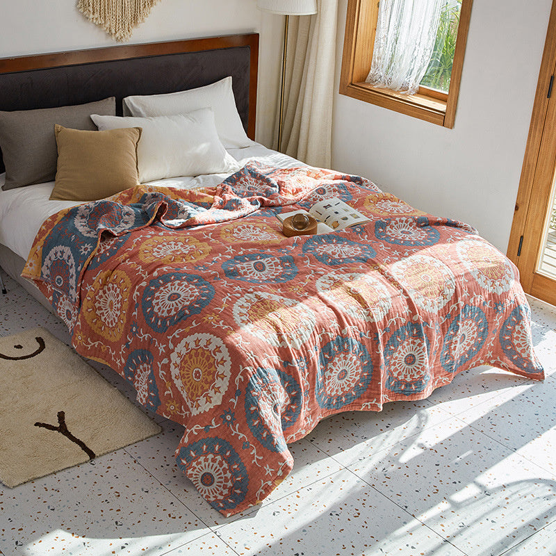 patterned quilt in a bright bedroom