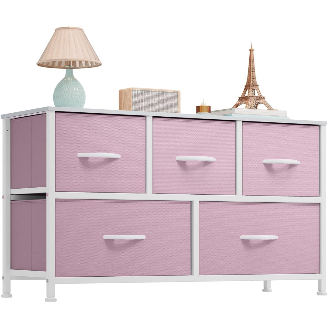 Pink dresser with white drawers on a white background