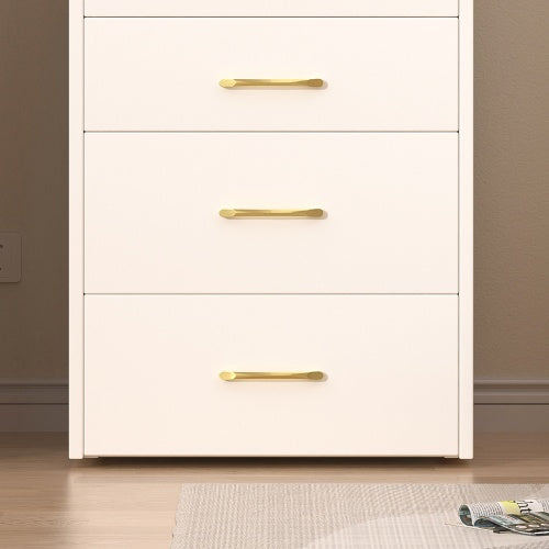 White cabinet with gold handles in a room setting
